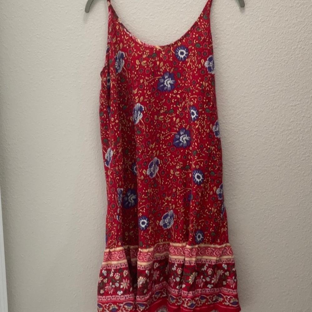 Spaghetti strap sundress, is as simple as they get. Red with blue flowers